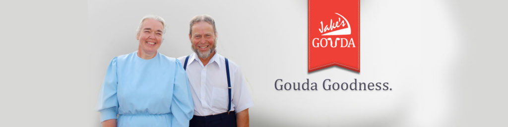Jake and Sylvia Stoltzfus With Gouda Goodness Banner